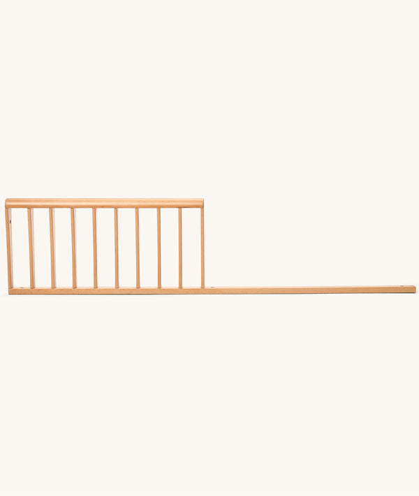 Product shot of the ergoPouch Skye Junior Sideguard, shown as an accessory that extends the crib’s lifespan.