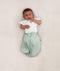 Baby wearing an ergoPouch Butterfly Cardi Natural with both arms out of swaddle