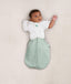 Baby wearing an ergoPouch Butterfly Cardi Natural with one arm out