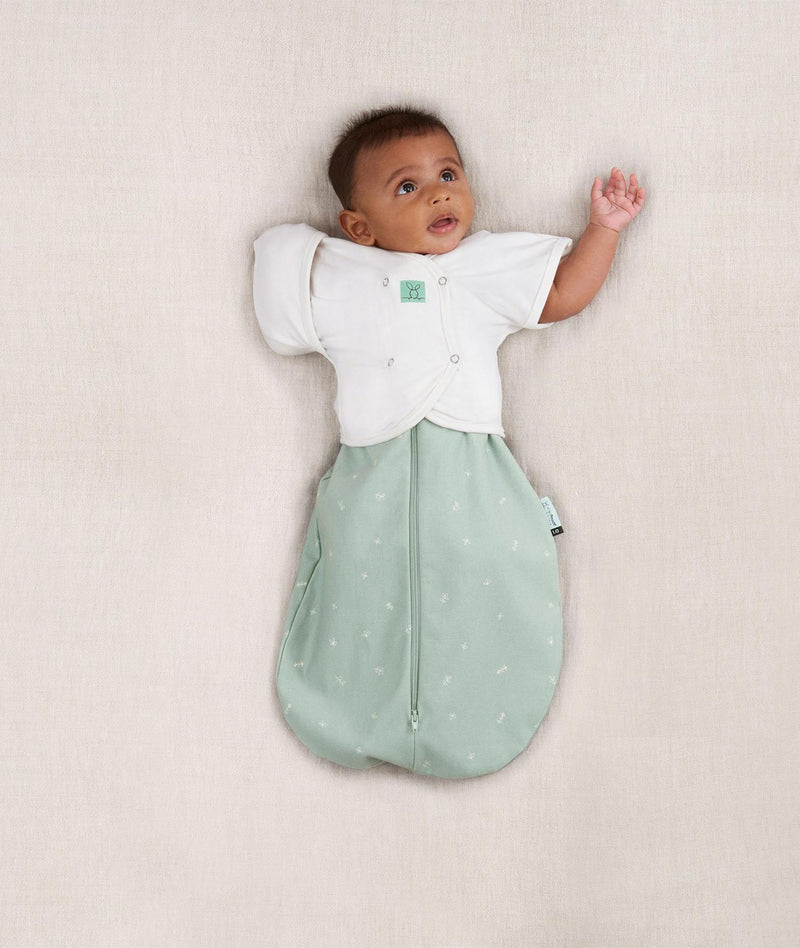 Baby wearing an ergoPouch Butterfly Cardi Natural with one arm out