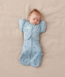 Newborn wearing ergoPouch Butterfly Cardi Dragonflies