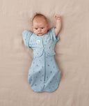 Baby wearing an ergoPouch Butterfly Cardi Dragonflies with one arm out