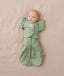 Newborn wearing ergoPouch Butterfly Cardi Willow and a matching Pouch