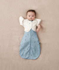 Baby wearing an ergoPouch Butterfly Cardi Oatmeal Marle with one arm out