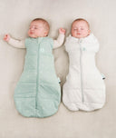 Babies being swaddled in ergoPouch Cocoon Swaddle Sack in Sage and Grey Marle