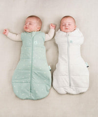 Babies being swaddled in ergoPouch Cocoon Swaddle Sack in Sage and Grey Marle