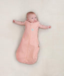 Newborn wearing ergoPouch Cocoon Swaddle Sack 1.0 TOG Berries, arms out sleeping 