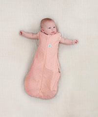 Newborn wearing ergoPouch Cocoon Swaddle Sack 1.0 TOG Berries, arms out sleeping 