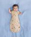 Baby sleeping with arms out in a ergoPouch Cocoon Swaddle Sack 1.0 TOG Birthday Blobs