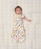 Newborn baby wearing ergoPouch Cocoon Swaddle Sack 0.2 TOG in Bon Appetit with one arm out