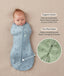 Newborn baby lying on a beige surface being swaddled in ergoPouch Cocoon Saddle Sack Dragonflies with text highlighting organic cotton and two-way zipper and a close-up image of the dual zippers.
