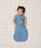 Newborn baby wearing ergoPouch Cocoon Swaddle Sack 0.2 TOG in Petit Pretzel with both arms out