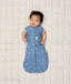 Newborn baby wearing ergoPouch Cocoon Swaddle Sack 0.2 TOG in Petit Pretzel with both arms out