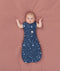 Baby transitioned to arms out sleeping easily with the ergoPouch Cocoon Swaddle Sack 1.0 TOG Starbeam