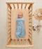 Newborn swaddled in ergoPouch Cocoon Swaddle Sack 1.0 TOG Dragonflies