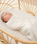 Newborn swaddled in ergoPouch Cocoon Swaddle Sack 1.0 TOG Oatmeal Marle