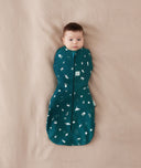 Newborn being swaddled in a Cocoon Swaddle sack 0.2 TOG Ocean Blue