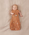 Baby sleeping with arms out in a ergoPouch Cocoon Swaddle Sack 0.2 TOG Sunny