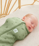 Close up of a newborn being swaddled in ergoPouch Cocoon Swaddle Sack 1.0 TOG Willow