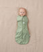 Newborn wearing an ergoPouch Cocoon Swaddle Sack 1.0 TOG Willow