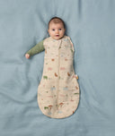 Baby wearing ergoPouch Cocoon Swaddle Sack with one arm out