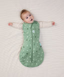 Baby sleeping with arms out in a ergoPouch Cocoon Swaddle Sack 2.5 TOG Sweet Orchard