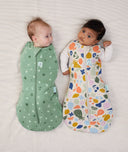 Two babies swaddled in ergoPouch Cocoon Swaddle Sack 2.5 TOG Sweet Orchard and Fruit Salad, warm for the winter