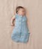Baby wearing a ergoPouch Cocoon Swaddle Sack 2.5 TOG Dragonflies, transitioning to arms out sleeping