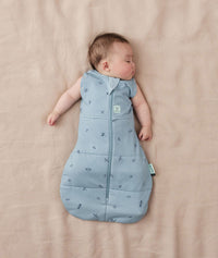 Baby sleeping with arms out in a ergoPouch Cocoon Swaddle Sack 3.5 TOG Dragonflies