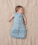 Baby sleeping with arms out in a ergoPouch Cocoon Swaddle Sack 2.5 TOG Dragonflies
