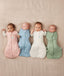 Newborn babies wearing heritage colors of ergoPouch Cocoon Swaddles