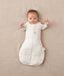 Baby sleeping with arms out in a ergoPouch Cocoon Swaddle Sack 3.5 TOG Oatmeal Marle