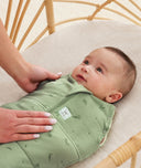 Newborn being swaddled in a ergoPouch Cocoon Swaddle Sack 2.5 TOG Willow