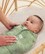 Newborn being swaddled in a ergoPouch Cocoon Swaddle Sack 2.5 TOG Willow