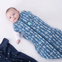Baby wearing a Cocoon Swaddle Sack with its one arm out