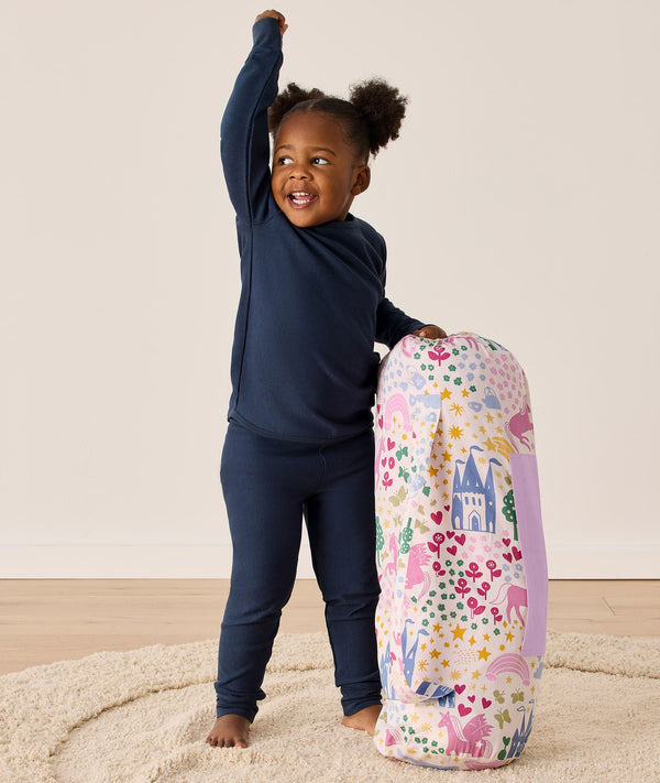 DreamRoll All-in-One Sleep Mat Unicorn Dreams holding carry bag