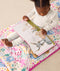 DreamRoll All-in-One Sleep Mat Unicorn Dreams reading a book sitting on mat