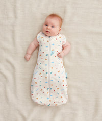Newborn wearing ergoPouch Cocoon Swaddle Sack 0.2 TOG Desert Bloom, from swaddle to sleep sack