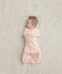 Baby asleep in a Cocoon Swaddle Sack 1.0 TOG Cute Fruit