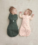 Newborns swaddled in ergoPouch Cocoon Swaddle Sack 1.0 TOG Cute Fruit and Veggie Patch