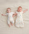 Newborns dressed in ergoPouch Cocoon Swaddle Sack 1.0 TOG and Long Sleeve Romper Desert Bloom