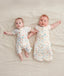 Newborns dressed in ergoPouch Cocoon Swaddle Sack 1.0 TOG and Long Sleeve Romper Desert Bloom