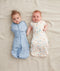 Newborn swaddled in ergoPouch Cocoon Swaddle Sack 1.0 TOG Desert Bloom