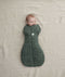 Baby wearing an ergoPouch Cocoon Swaddle Sack 2.5 TOG Veggie Patch