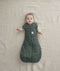 Baby wearing an ergoPouch Cocoon Swaddle Sack 2.5 TOG Veggie Patch with its arms out