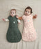 Two babies wearing ergoPouch Cocoon Swaddle Sack 2.5 TOG