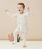 Child wearing  ergoPouch Long Sleeve Romper 0.2 TOG Desert Bloom