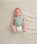 Newborn wearing the ergoPouch Bodywear Singlet in Sage