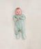 Newborn wearing the ergoPouch Long Sleeve Romper 0.2 TOG Sage