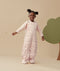 A child in a ergoPouch Sleep Suit Sack 2.5 TOG Cute Fruit, perfect for the winter
